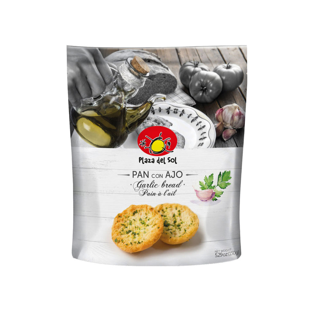 Packaged garlic bread with olive oil and apples in the background